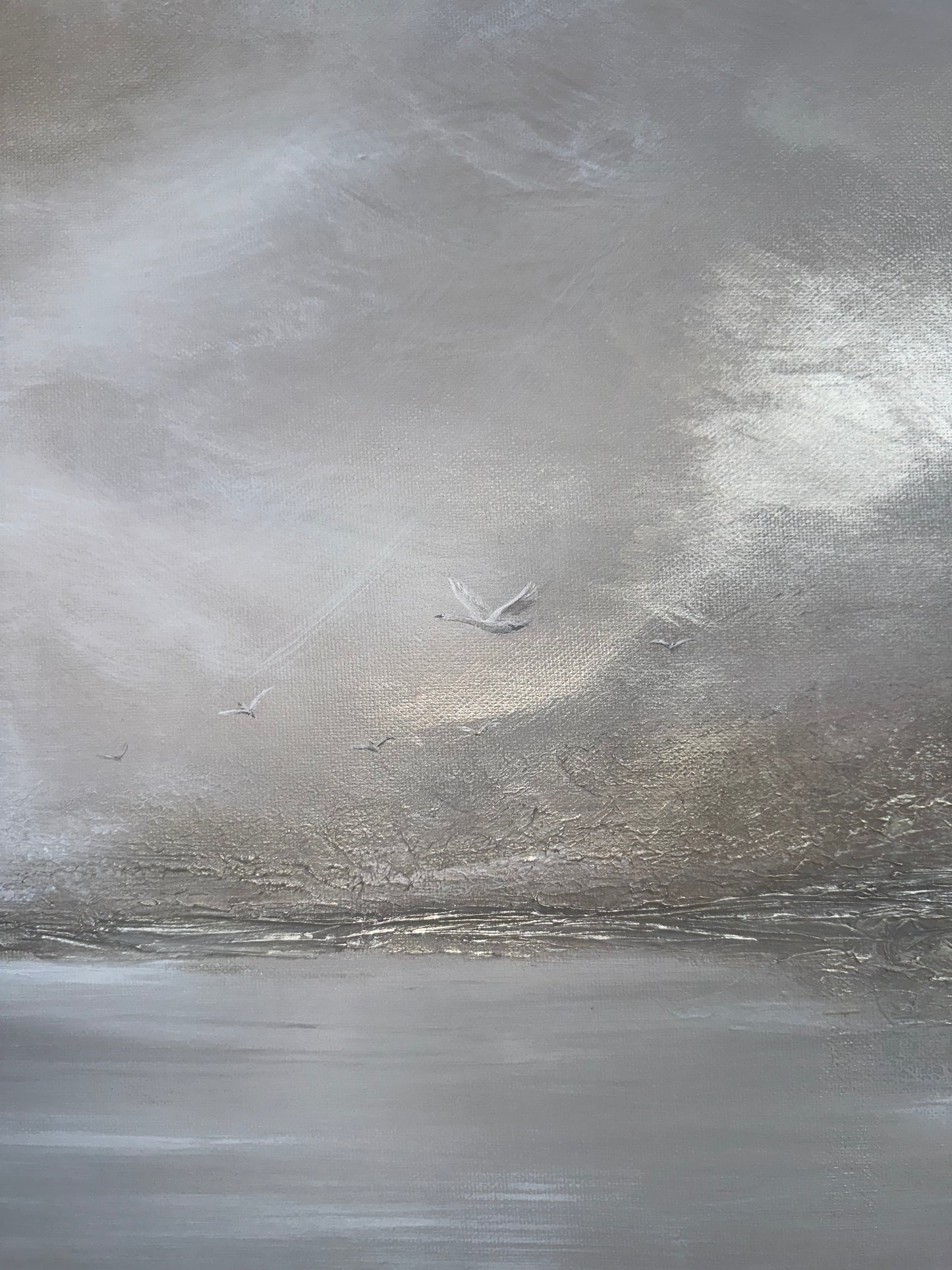Close-up of a textured gray surface with a small swan