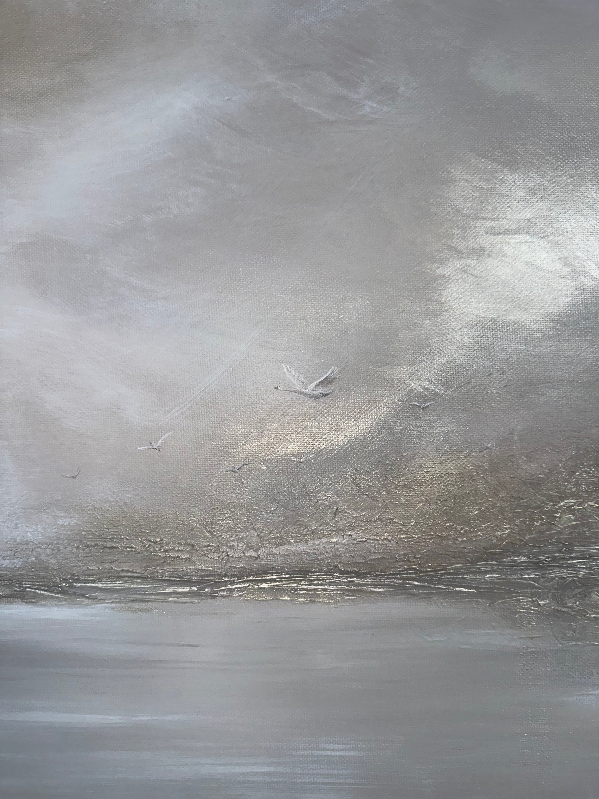 Close-up of a textured gray surface with a small swan