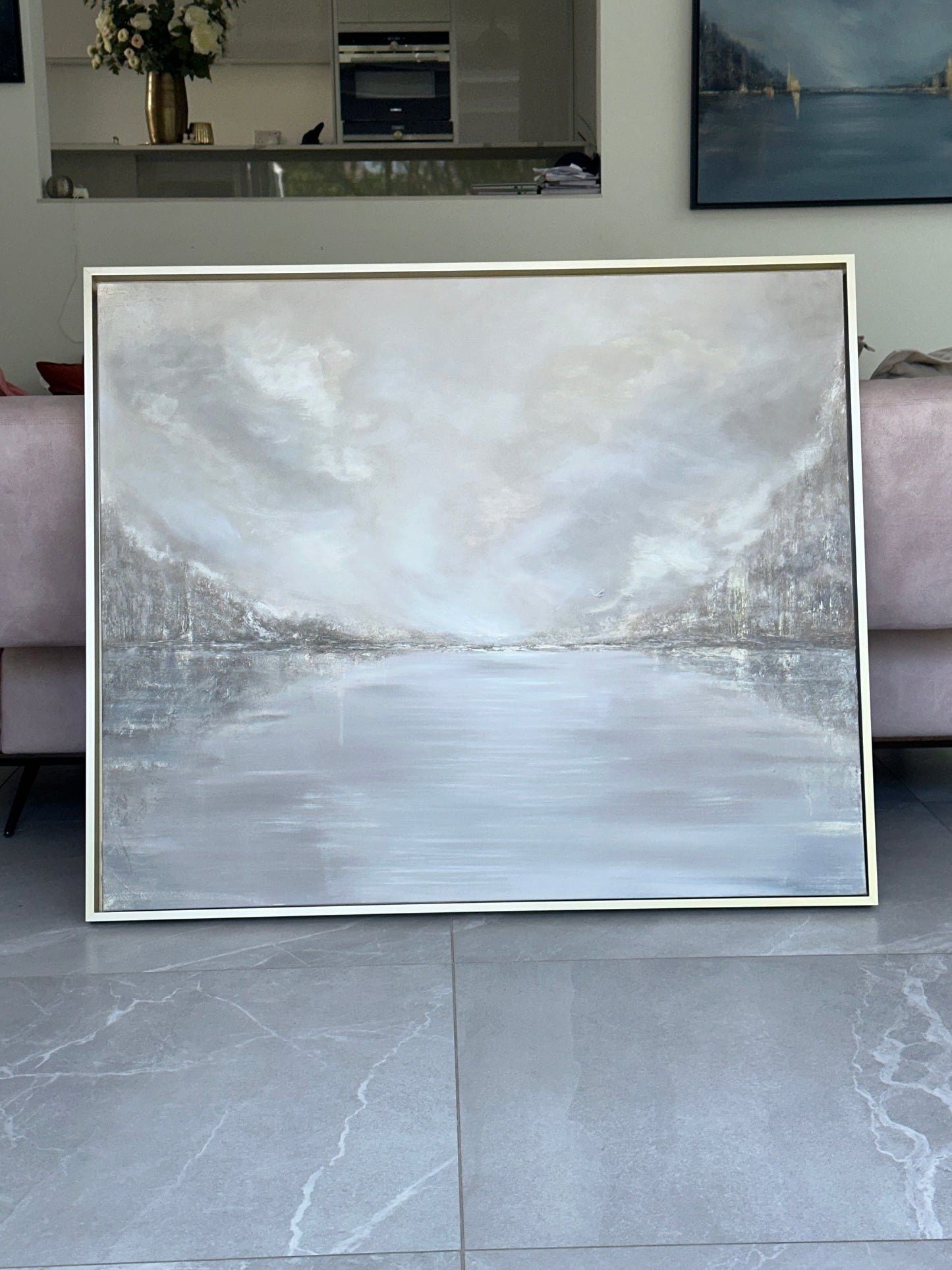 Contemporary abstract wall art showing a serene lake with subtle reflections, textured brushwork, and a neutral grey and white palette